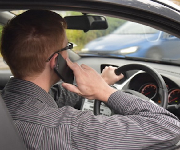 Fewer drivers caught by police for mobile phone use