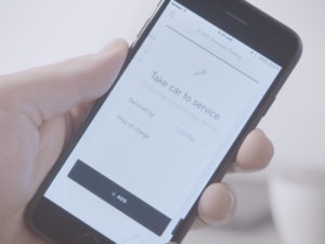 Mobile phone showing Volvo's pilot concierge services app