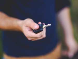 Driver holding key