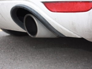Exhaust pipe on white car