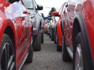 Row of red and grey cars