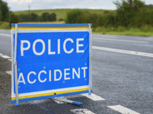 Police accident sign on road