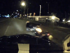 Dashcam image of motorcyclist overtaking driver