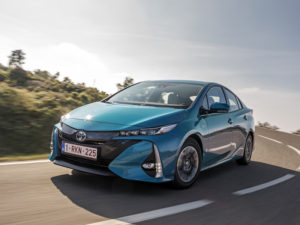 Toyota Prius Plug-in being driven along road