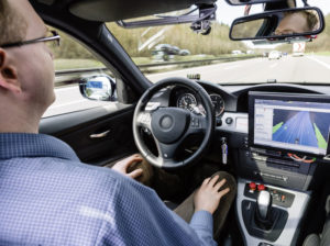 Man using autonomous vehicle in automated mode