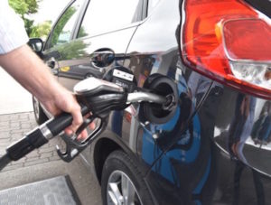 Man filling car with fuel