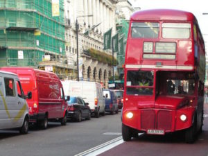 Red bus in London bus lane