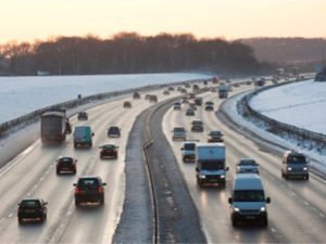 Drivers on snowy motorway 