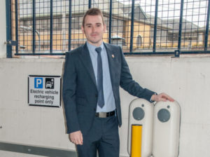 Southampton City Council Cabinet Member for Sustainable Living, Councillor Christopher Hammond with two of the chargers in the Bedford Place car park.