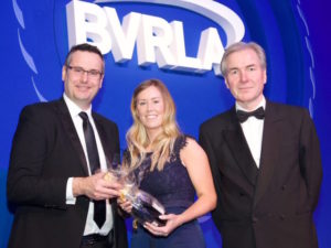 Alphabet’s Hannah Broad receiving her award from Owen Gregory, director fleet operations at Ford Motor Company, with BVRLA chief executive, Gerry Keaney (right).