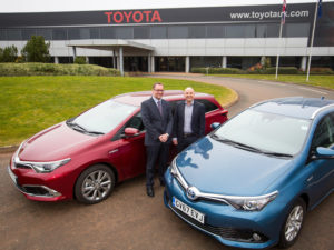 L-R: Toyota’s Alan Barrett hands over the Auris Hybrids to Jim Gregory of Defra Group Fleet Services