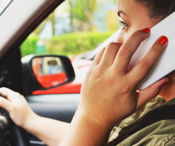 A million drivers admit to using hand-held mobiles on every car journey