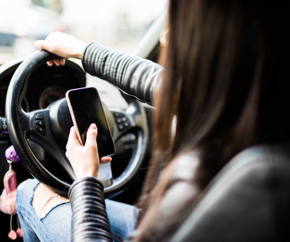All handheld mobile phone use while driving to become illegal next year